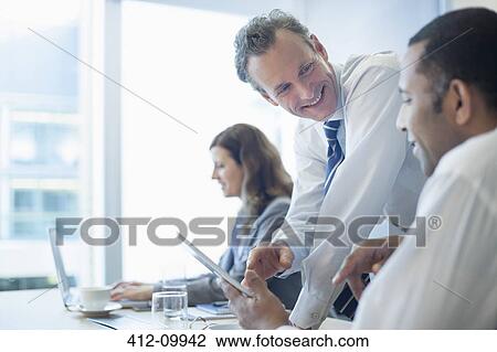 Business people working in office View Large Photo Image Stock Image - Business people working in office. Fotosearch