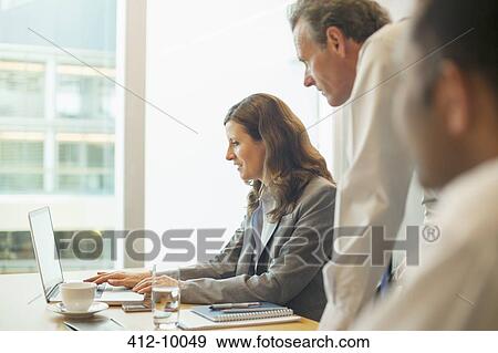 Business people working in office View Large Photo Image Stock Photo - Business people working in office. Fotosearch