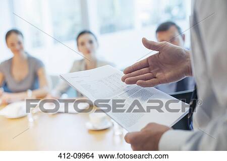 Businessman leading meeting in conference room View Large Photo Image Picture - Businessman leading meeting in conference room. Fotosearch