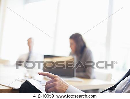 Businessman talking in meeting View Large Photo Image Stock Photo - Businessman talking in meeting. Fotosearch