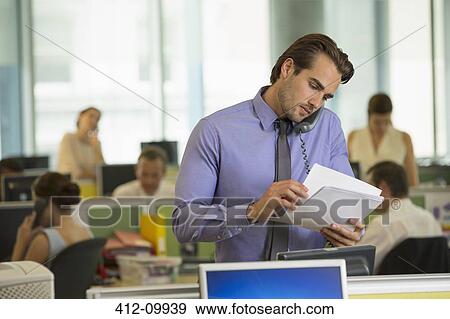 Stock Photo - Businessman working in office. Fotosearch