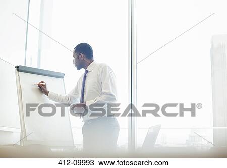Businessman writing on whiteboard View Large Photo Image Stock Image - Businessman writing on whiteboard. Fotosearch