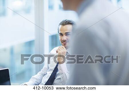 Stock Image - Businessmen in office. Fotosearch