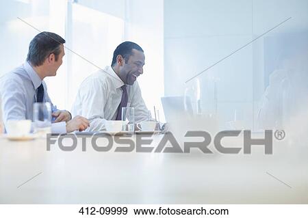 Businessmen talking in meeting View Large Photo Image Stock Photo - Businessmen talking in meeting. Fotosearch