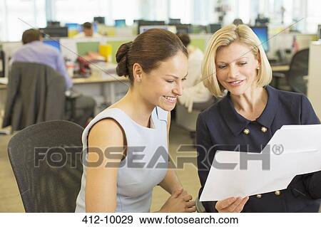 Businesswomen working in office View Large Photo Image Stock Photo - Businesswomen working in office. Fotosearch