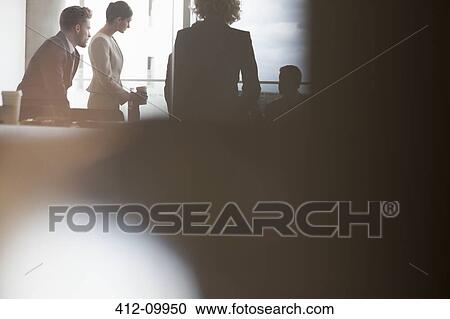 Silhouette of business people talking in meeting View Large Photo Image Stock Image - Silhouette of business people talking in meeting. Fotosearch