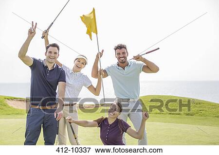 Enthusiastic friends waving on golf course View Large Photo Image Stock Photo - Enthusiastic friends waving on golf course. Fotosearch