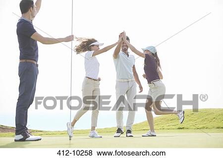 Friends celebrating on golf course View Large Photo Image Stock Photo - Friends celebrating on golf course. Fotosearch