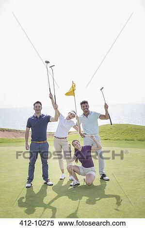 Playful friends on golf course View Large Photo Image Stock Photography - Playful friends on golf course. Fotosearch