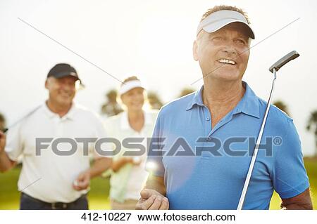 Senior adults on golf course View Large Photo Image Stock Photo - Senior adults on golf course. Fotosearch