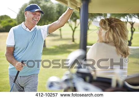 Senior couple in golf cart View Large Photo Image Stock Photo - Senior couple in golf cart. Fotosearch