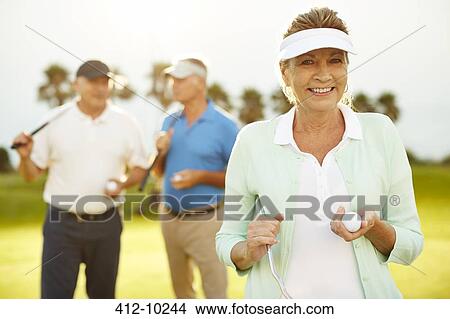 Senior friends on golf course View Large Photo Image Picture - Senior friends on golf course. Fotosearch