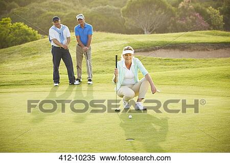 Senior friends playing golf on course View Large Photo Image Stock Photography - Senior friends playing golf on course. Fotosearch