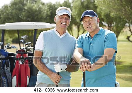 Stock Photograph - Senior men on golf course. Fotosearch
