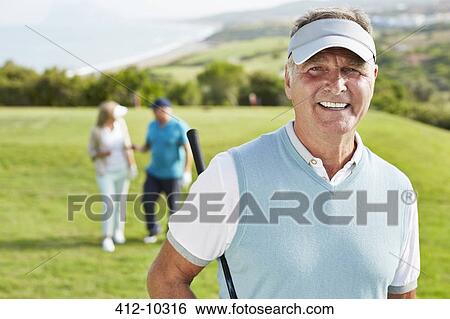 Smiling senior man on golf course View Large Photo Image Stock Photograph - Smiling senior man on golf course. Fotosearch