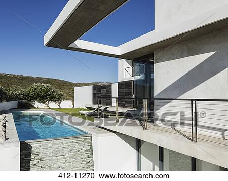Stock Image - Balcony and lap pool of modern house. Fotosearch