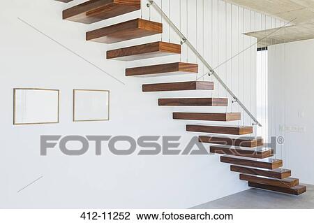 Floating stairs in modern house View Large Photo Image Stock Image - Floating stairs in modern house. Fotosearch