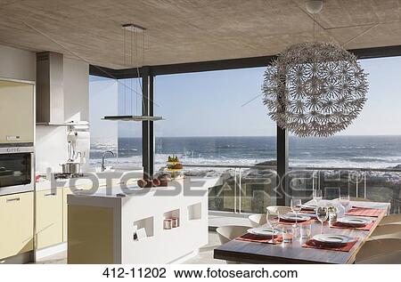 Kitchen and dining room in modern house overlooking ocean View Large Photo Image Stock Image - Kitchen and dining room in modern house overlooking ocean. Fotosearch