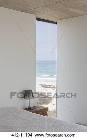 Modern bedroom with ocean view View Large Photo Image Picture - Modern bedroom with ocean view. Fotosearch