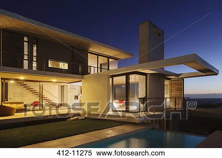 Modern house illuminated at night View Large Photo Image Stock Photography - Modern house illuminated at night. Fotosearch