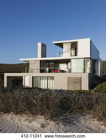 Stock Image - Modern house on beach. Fotosearch