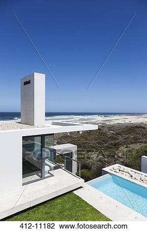 Modern house overlooking ocean View Large Photo Image Stock Image - Modern house overlooking ocean. Fotosearch