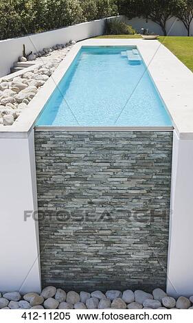 Stone wall of modern lap pool View Large Photo Image Stock Photography - Stone wall of modern lap pool. Fotosearch