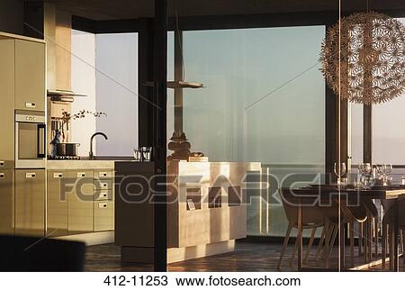 Windows surrounding modern kitchen View Large Photo Image Stock Image - Windows surrounding modern kitchen. Fotosearch