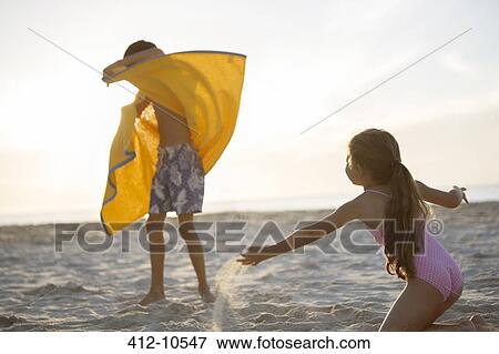 Children playing on beach View Large Photo Image Stock Photo - Children playing on beach. Fotosearch