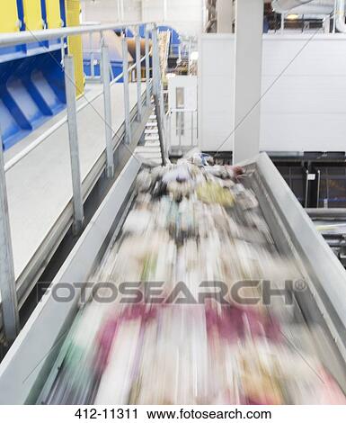 Blurred view of conveyor belt in factory View Large Photo Image Stock Image - Blurred view of conveyor belt in factory. Fotosearch