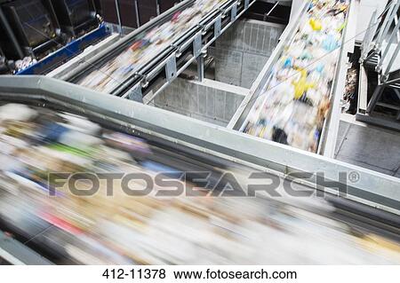 Blurred view of conveyor belts in recycling center View Large Photo Image Stock Photo - Blurred view of conveyor belts in recycling center. Fotosearch