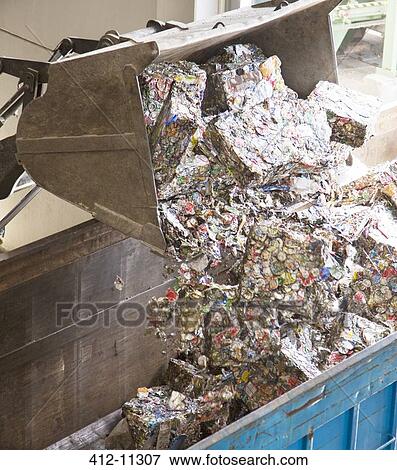 Bucket dumping recycled bundles into bin View Large Photo Image Stock Photo - Bucket dumping recycled bundles into bin. Fotosearch