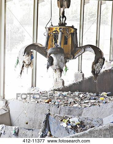 Claw releasing recycling in recycling center View Large Photo Image Stock Photo - Claw releasing recycling in recycling center. Fotosearch