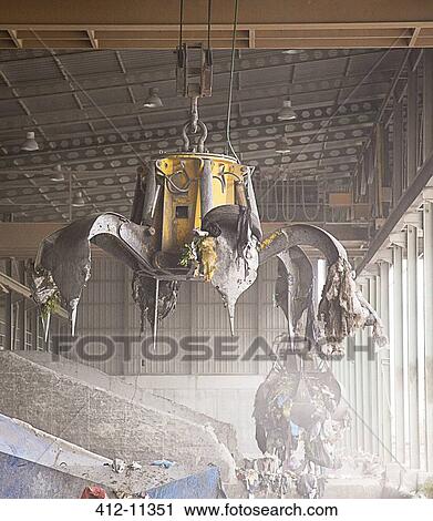 Magnet claw in recycling center View Large Photo Image Stock Image - Magnet claw in recycling center. Fotosearch