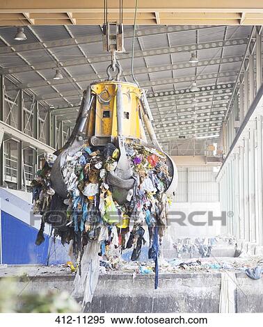 Magnet lifting recycled material in factory View Large Photo Image Stock Photography - Magnet lifting recycled material in factory. Fotosearch