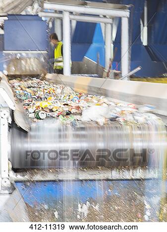 Recycled material on conveyor belt in recycling center View Large Photo Image Stock Photo - Recycled material on conveyor belt in recycling center. Fotosearch