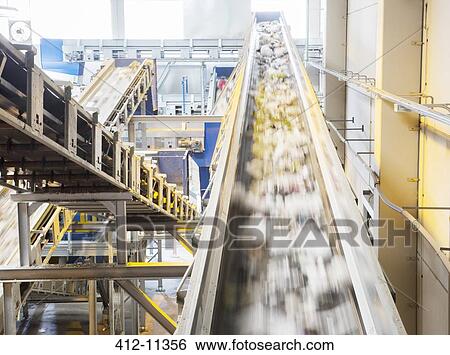 Recycling on conveyor belt in recycling center View Large Photo Image Stock Photograph - Recycling on conveyor belt in recycling center. Fotosearch