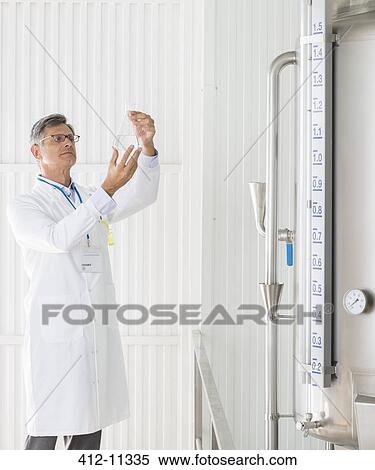 Stock Photography - Scientist working in food processing plant. Fotosearch