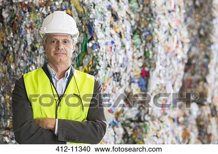 Supervisor standing in recycling plant View Large Photo Image Stock Image - Supervisor standing in recycling plant. Fotosearch