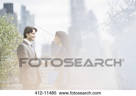 Business people shaking hands outdoors View Large Photo Image Stock Photography - Business people shaking hands outdoors. Fotosearch