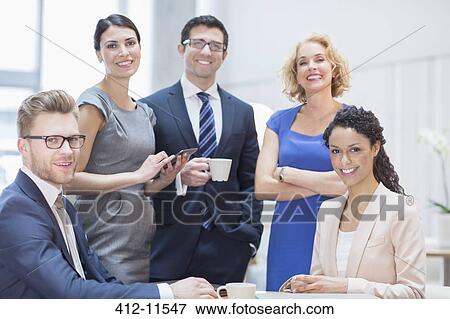Business people smiling in meeting View Large Photo Image Stock Photo - Business people smiling in meeting. Fotosearch