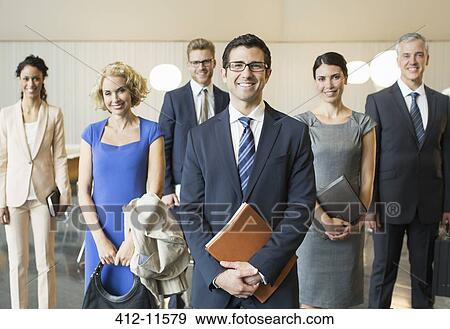 Business people smiling in office View Large Photo Image Stock Photo - Business people smiling in office. Fotosearch