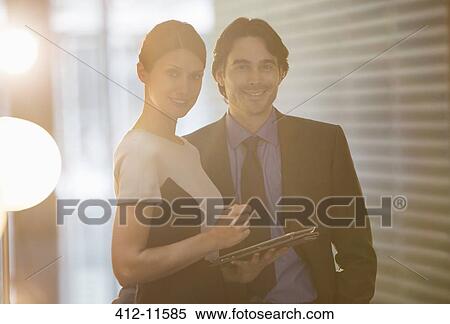 Business people smiling in office View Large Photo Image Stock Photography - Business people smiling in office. Fotosearch