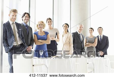 Stock Photo - Business people smiling in restaurant. Fotosearch