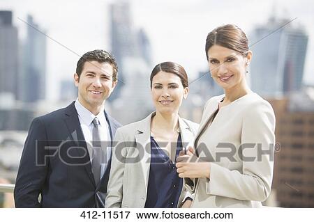 Stock Photo - Business people smiling outdoors. Fotosearch
