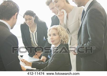 Business people talking in meeting View Large Photo Image Picture - Business people talking in meeting. Fotosearch