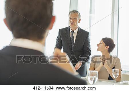 Business people talking in meeting View Large Photo Image Picture - Business people talking in meeting. Fotosearch