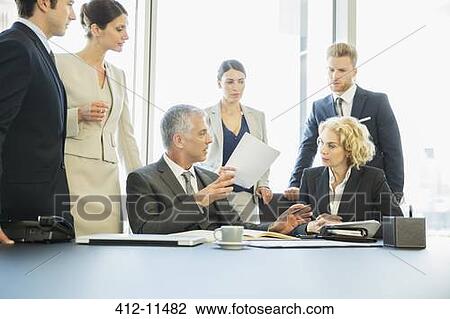 Business people talking in meeting View Large Photo Image Stock Image - Business people talking in meeting. Fotosearch
