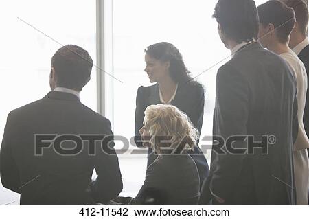 Business people talking in meeting View Large Photo Image Stock Image - Business people talking in meeting. Fotosearch