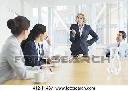 Stock Photo - Business people talking in meeting. Fotosearch